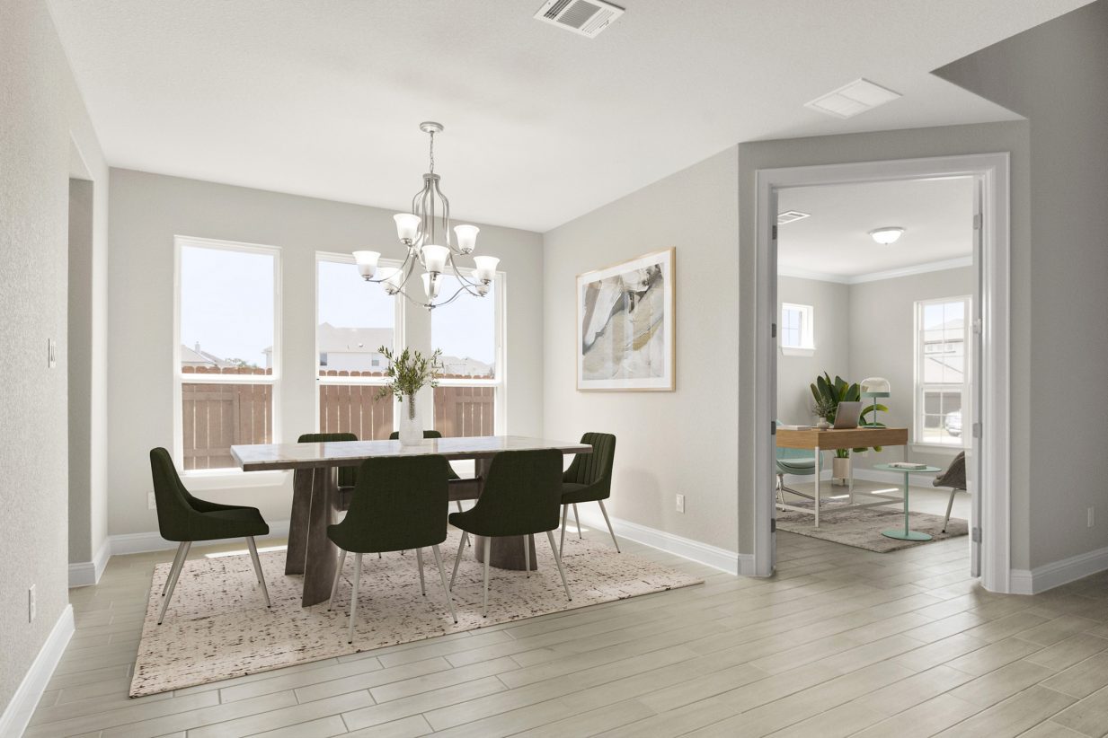 Image of a dining room with a dining table with green chairs and a connecting office space