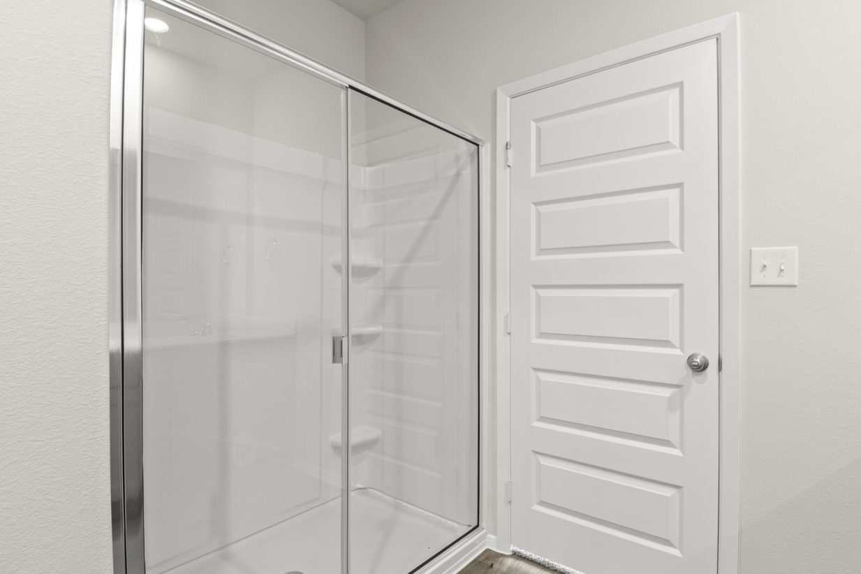 Image of primary bathroom with a walk in shower