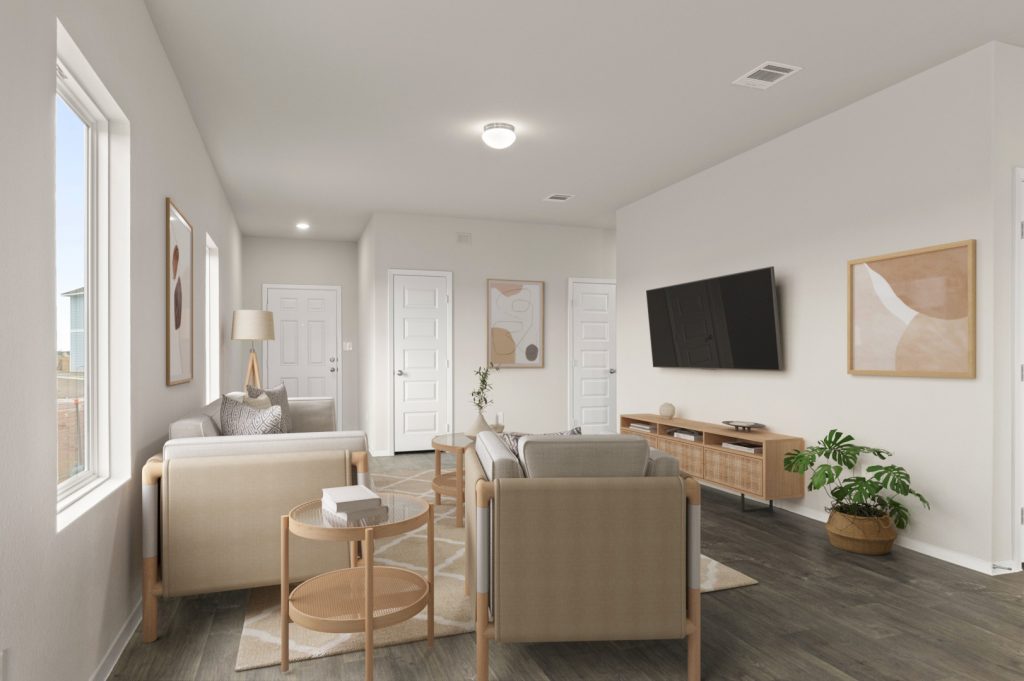 Image of staged living room with light wood scandinavian couch, chair, coffee table, entertainment center, and wall decor