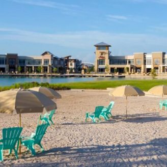 Sandy beach and swimming lagoon at a master-planned community park in Cypress, Texas.