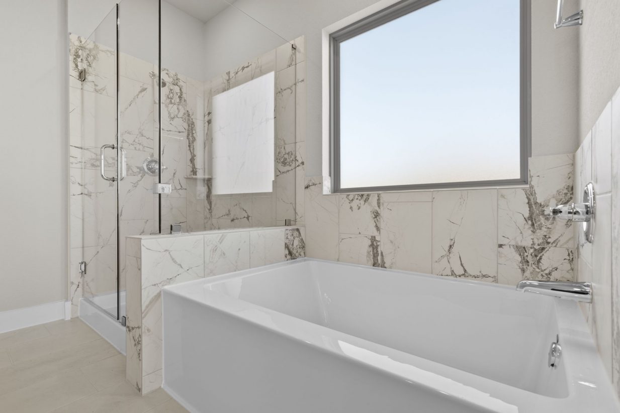 Image of a primary bathroom with a standing walk-in shower, a garden tub, and a window
