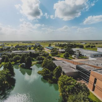 Families enjoying recreation at waterpark attractions and sports venues near Brohn Homes new construction in Rosharon, Texas.