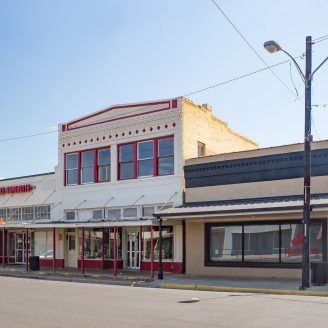 Sealy, shopping New Brohn Homes residents shopping along historic Sealy Main Street with restored storefronts and local boutiques.