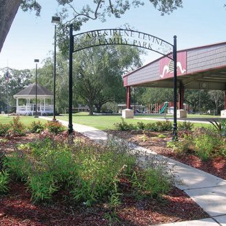 outdoors, Sealy Brohn Homes new construction neighborhood in Sealy with tree-lined streets and residents enjoying nearby community parks and outdoor trails.