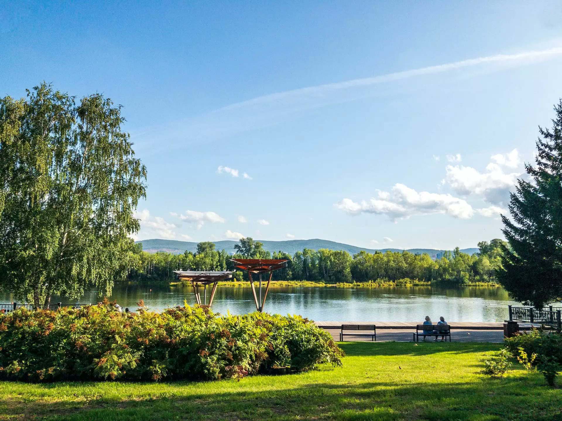 Residents biking and hiking along wooded trails near Brohn Homes new construction in Tomball, Texas with scenic Spring Creek Greenway.