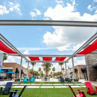 Sugar Land, Texas shopping center with retail stores, dining, and outdoor gathering spaces—convenient amenities for new home residents