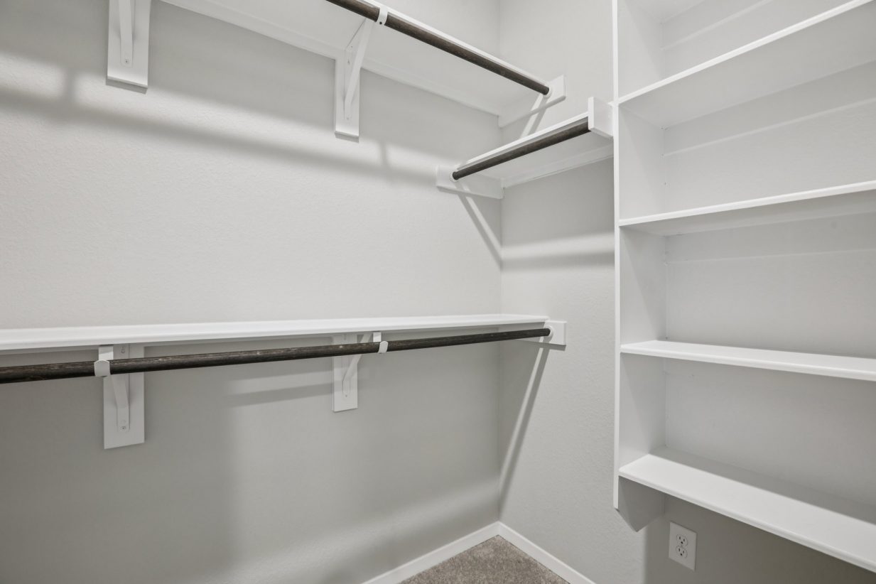 Image of a primary closet with shelving