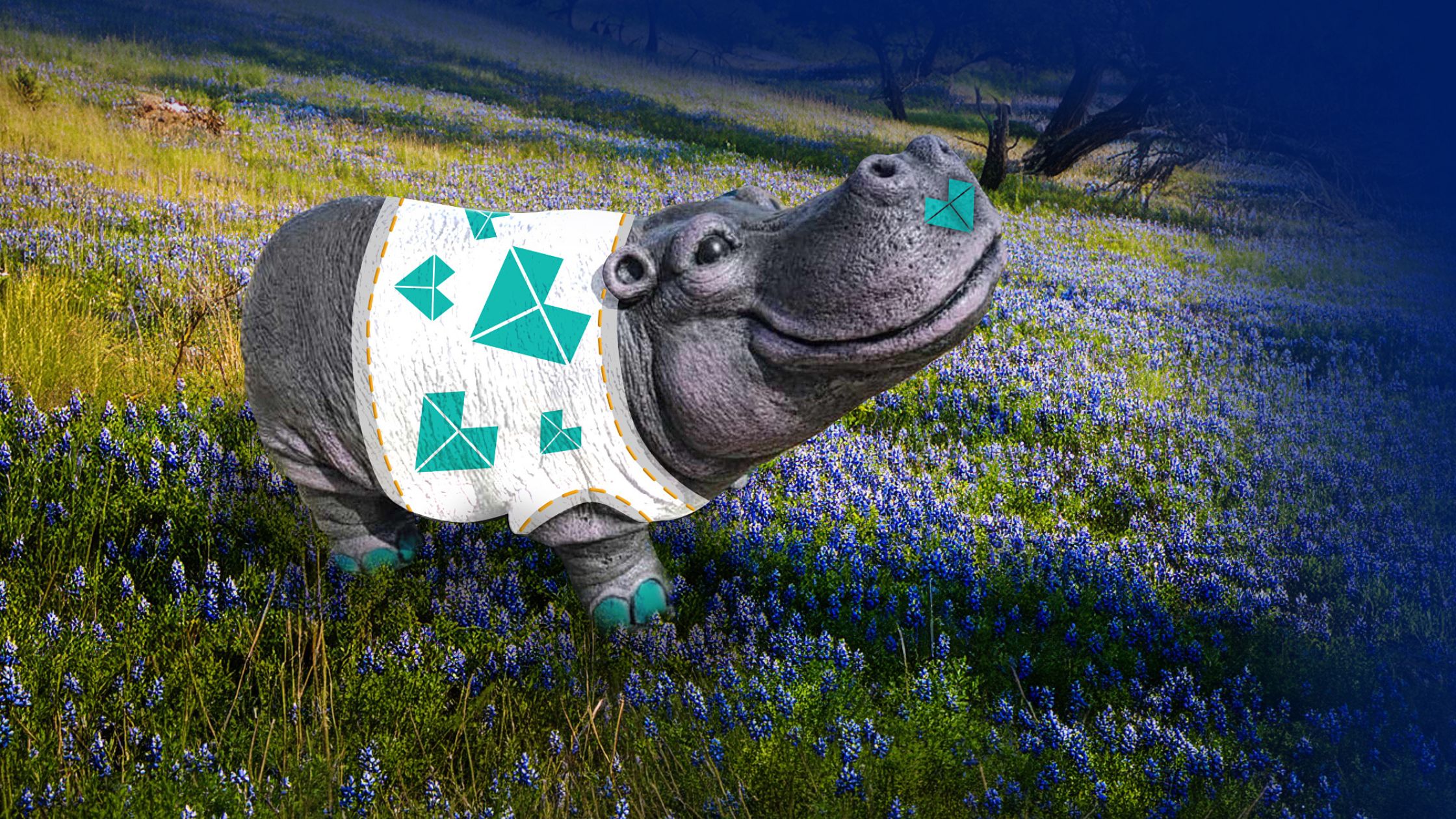 An image of gray hippo statue with a teal Brohn heart on its nose and a white t-shirt covered in teal hearts. The hippo is surrounded by a green landscape with blue bonnets.