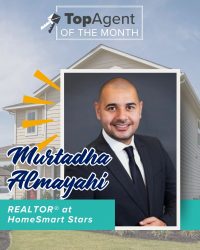 A graphic of a man with a black suit with white shirt with a black tie with a white frame with a background of yellow house and the words "TopAgent of the Month".