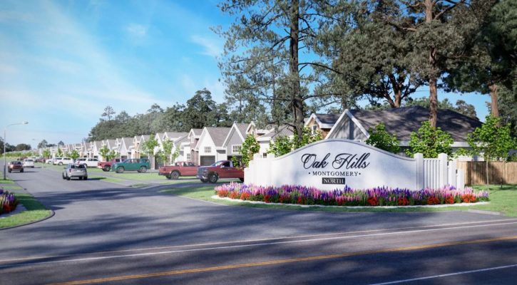 Image of a neighborhood with single-sotry houses, paved roads, cars and trucks, green grass, trees, and a monument stone sign with the words "Oak Hills, Montgomery, an North in dark brown letters with a blue sky in the background.